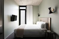 Ein Bett oder Betten in einem Zimmer der Unterkunft Alex Hotel