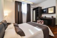 A bed or beds in a room at Hotel Palma