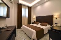 A bed or beds in a room at Hotel Palma