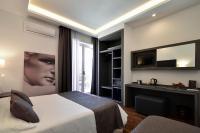 A bed or beds in a room at Hotel Palma