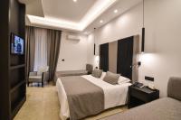 A bed or beds in a room at Hotel Palma