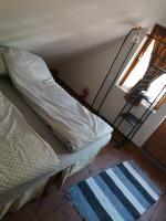 Posteľ alebo postele v izbe v ubytovaní Lisztes Apartman (medencés, nádfedeles, Zamárdi)