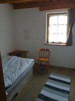 Posteľ alebo postele v izbe v ubytovaní Lisztes Apartman (medencés, nádfedeles, Zamárdi)