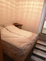 Posteľ alebo postele v izbe v ubytovaní Lisztes Apartman (medencés, nádfedeles, Zamárdi)
