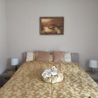 Łóżko lub łóżka w pokoju w obiekcie Balázs Apartman