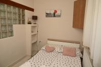 Łóżko lub łóżka w pokoju w obiekcie Pálma Apartman