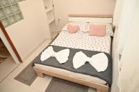 Łóżko lub łóżka w pokoju w obiekcie Pálma Apartman