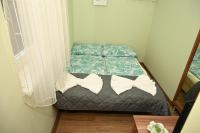 Łóżko lub łóżka w pokoju w obiekcie Pálma Apartman