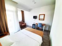 A bed or beds in a room at Karden Otel