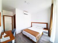 A bed or beds in a room at Karden Otel