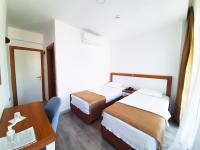 A bed or beds in a room at Karden Otel