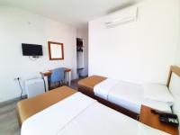 A bed or beds in a room at Karden Otel
