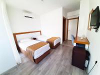 A bed or beds in a room at Karden Otel