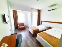 A bed or beds in a room at Karden Otel
