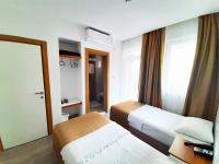 A bed or beds in a room at Karden Otel