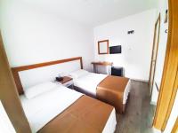 A bed or beds in a room at Karden Otel