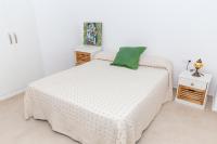 A bed or beds in a room at Cap de Mar CULLERA