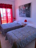 Postel nebo postele na pokoji v ubytování Apartamentos en Playa de Samil Primera Línea de playa Pe Na Areia