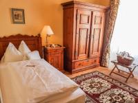 A bed or beds in a room at Hotel See-Villa