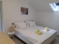 Postel nebo postele na pokoji v ubytování Apartments Gverić