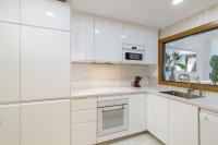 A kitchen or kitchenette at PARADISE SUITES Buenavista Beach