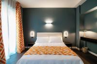 Łóżko lub łóżka w pokoju w obiekcie In Centro Luxury Rooms