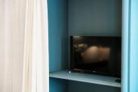 Telewizja i/lub zestaw kina domowego w obiekcie In Centro Luxury Rooms