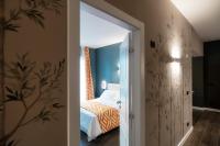 Łóżko lub łóżka w pokoju w obiekcie In Centro Luxury Rooms