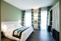 Łóżko lub łóżka w pokoju w obiekcie In Centro Luxury Rooms