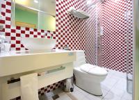 a bathroom with a toilet and a sink and a shower at NL Concept Hotel in Kaohsiung