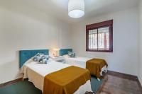 A bed or beds in a room at PARADISE SUITES Buenavista Beach