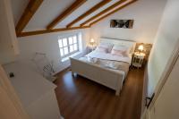 Katil atau katil-katil dalam bilik di Villa Perliano