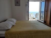 Postel nebo postele na pokoji v ubytování Anic Apartments Stanići