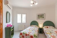 Postel nebo postele na pokoji v ubytování Villa Oasis - Costa CarpeDiem