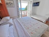 Posteľ alebo postele v izbe v ubytovaní Apartments Vukadin