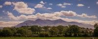 a view of a mountain range with trees and clouds at Rookery Mews Apartments - Killarney Self Catering in Killarney