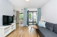 Televízia a/alebo spoločenská miestnosť v ubytovaní Awanport Rentyear Apartments
