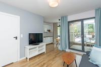 Televízia a/alebo spoločenská miestnosť v ubytovaní Awanport Rentyear Apartments
