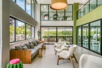 a living room with a couch and chairs at Porto Kaeté Hotel in Maceió