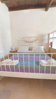 A bed or beds in a room at La Piazzetta