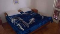 Postel nebo postele na pokoji v ubytování Apartment in Starigrad-Paklenica 6806