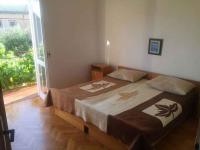 Postel nebo postele na pokoji v ubytování Apartment in Starigrad-Paklenica 6806