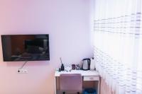 Televízia a/alebo spoločenská miestnosť v ubytovaní The Place Apartments Hebrangova