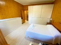 Postel nebo postele na pokoji v ubytování Apartamentos en Playa de Samil Primera Línea de playa Pe Na Areia