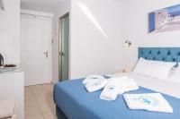 Postel nebo postele na pokoji v ubytování Denise Beach Hotel