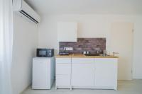 Kuchyňa alebo kuchynka v ubytovaní Zigzag Apartman