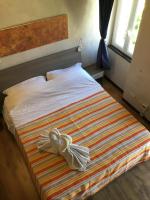A bed or beds in a room at New Arcobaleno Ossegna