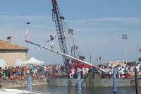 a person jumping off a pole in the water at Holiday Home With Pool In Marseillan in Marseillan