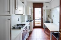 A kitchen or kitchenette at Appartamento Calmo 3SX