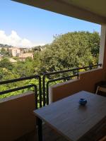 a table on a balcony with a view at Studio with large balcony and nice view by Weekome in Vallauris